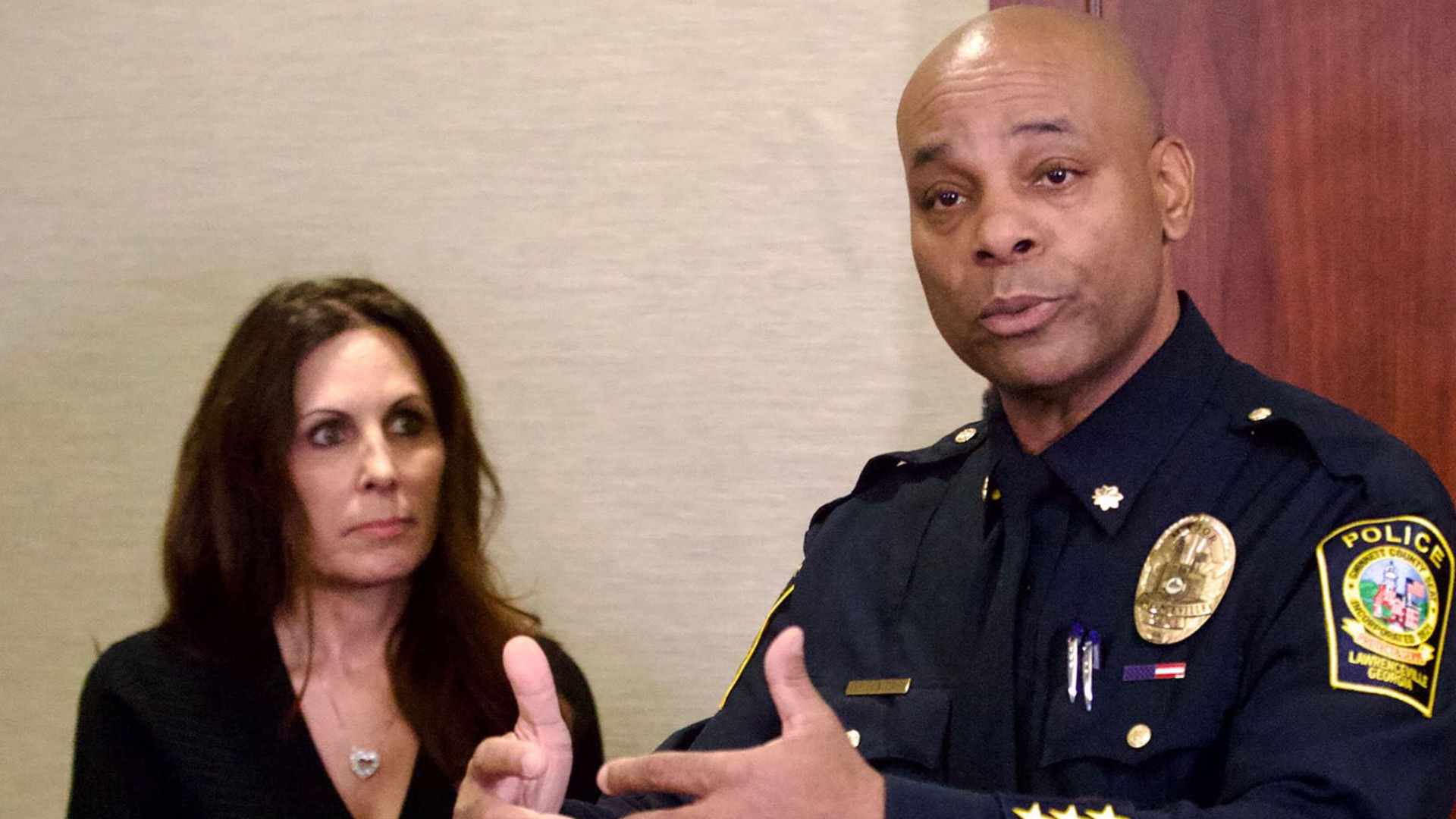 Maj. Myron Walker, his wife by his side, held a press conference at the Lawrenceville Police Department on Thursday to acknowledge past sexual transgressions when he was a a supervisor at the Gwinnett County Sheriff's Office. Credit: Steve Schaefer for The Atlanta Journal-Constitution.
