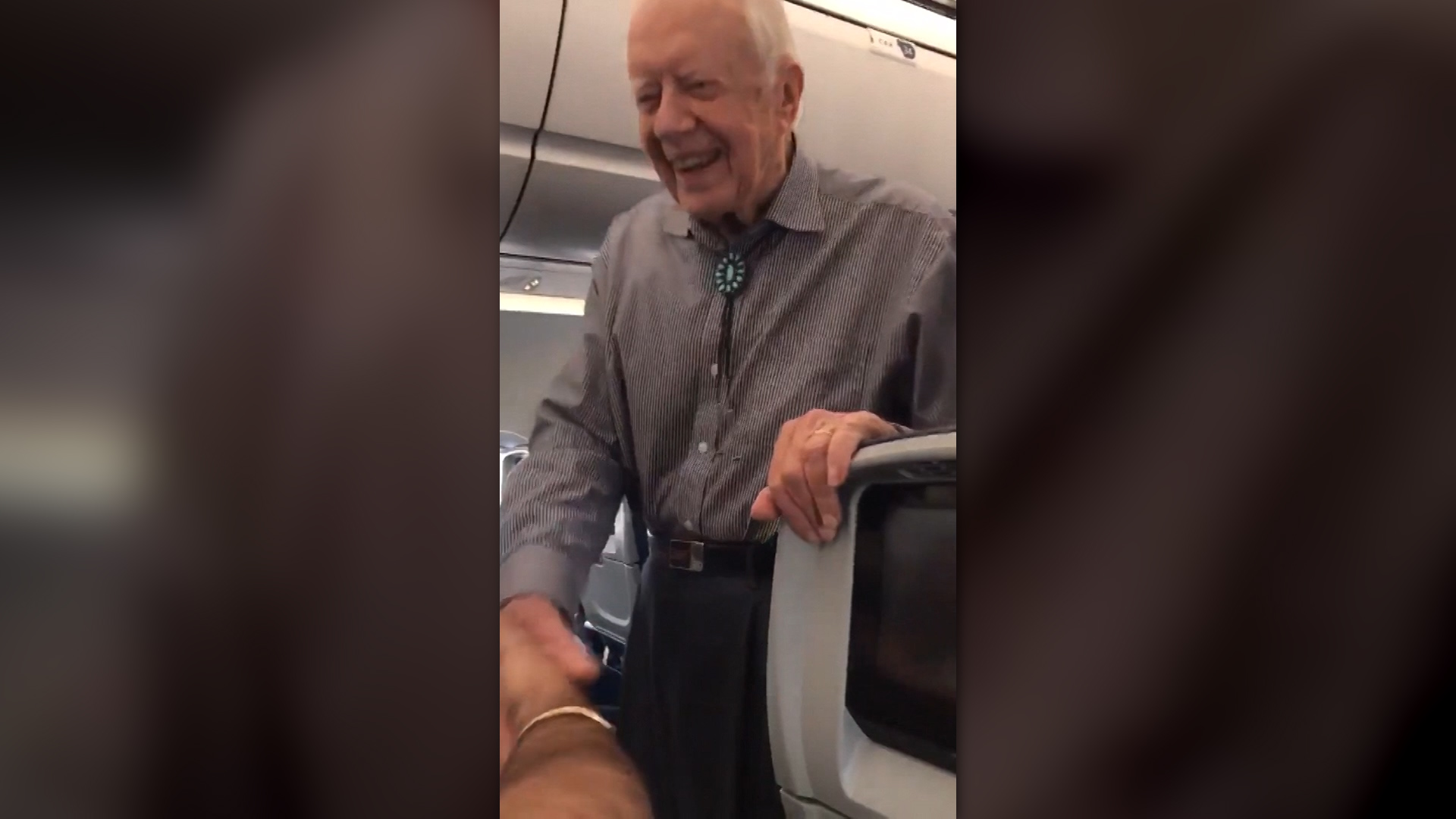 Former President Jimmy Carter Shakes Hands With Every Passenger On Flight
